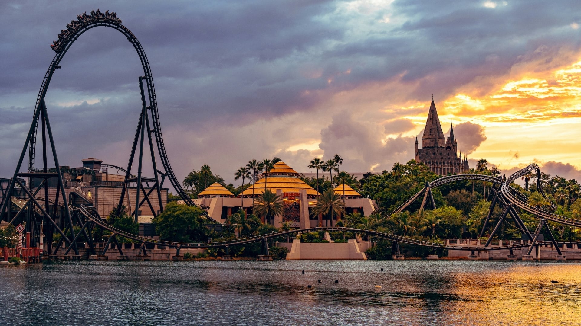 A Universal theme park roller coaster at dusk